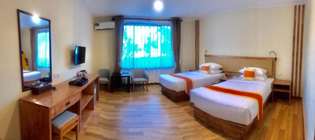 Postel nebo postele na pokoji v ubytování Acacia Hotel Bagan