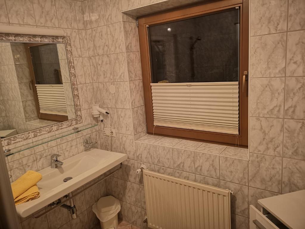 Koupelna v ubytování Hotel Pension Siggi