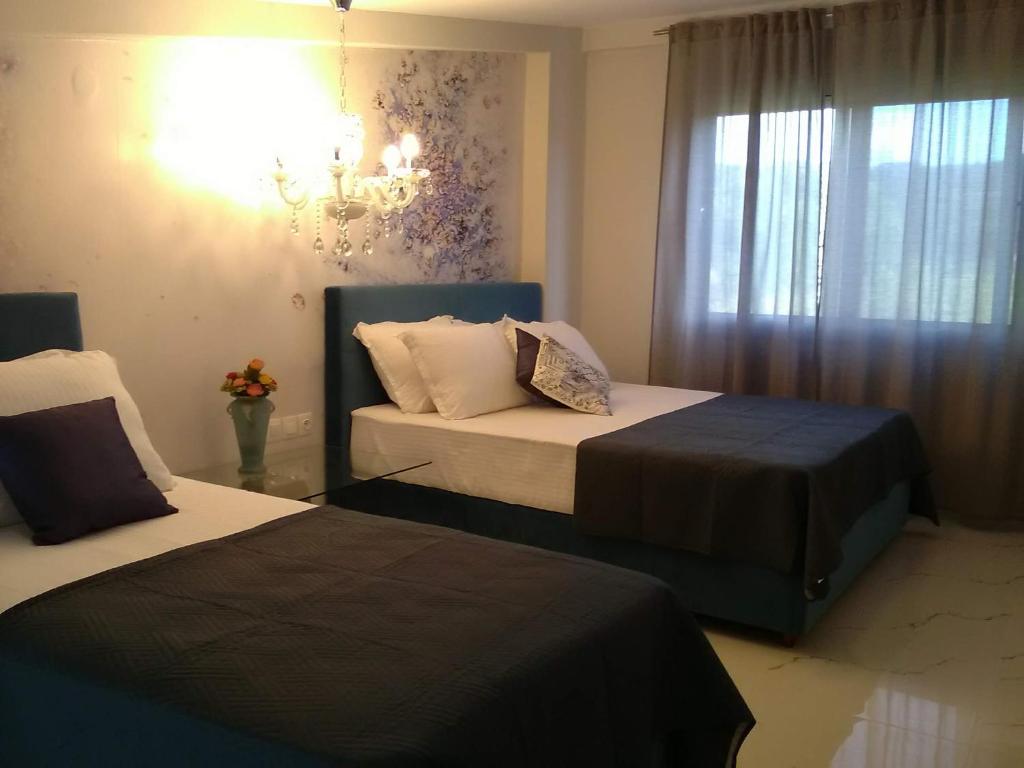 Postel nebo postele na pokoji v ubytování Divine Luxury Apartments