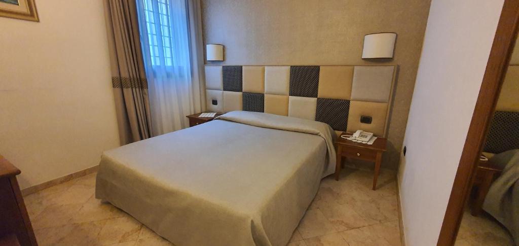 Postel nebo postele na pokoji v ubytování Hotel Classensis