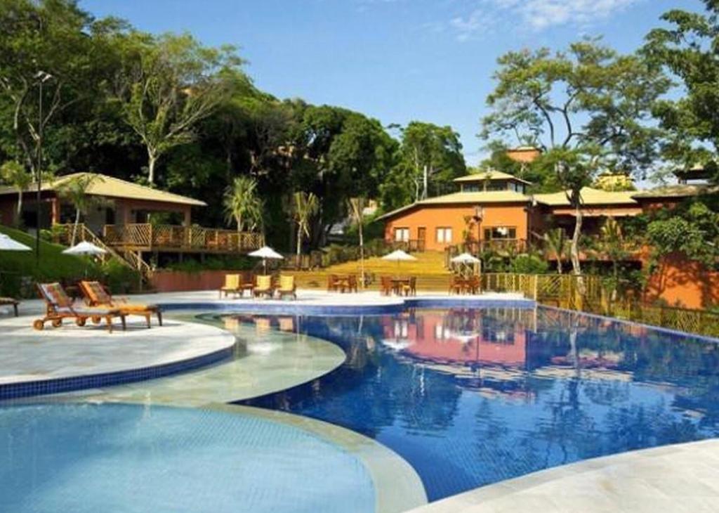 Piscina en o cerca de Bangalô em Ilhabela/Yacamim