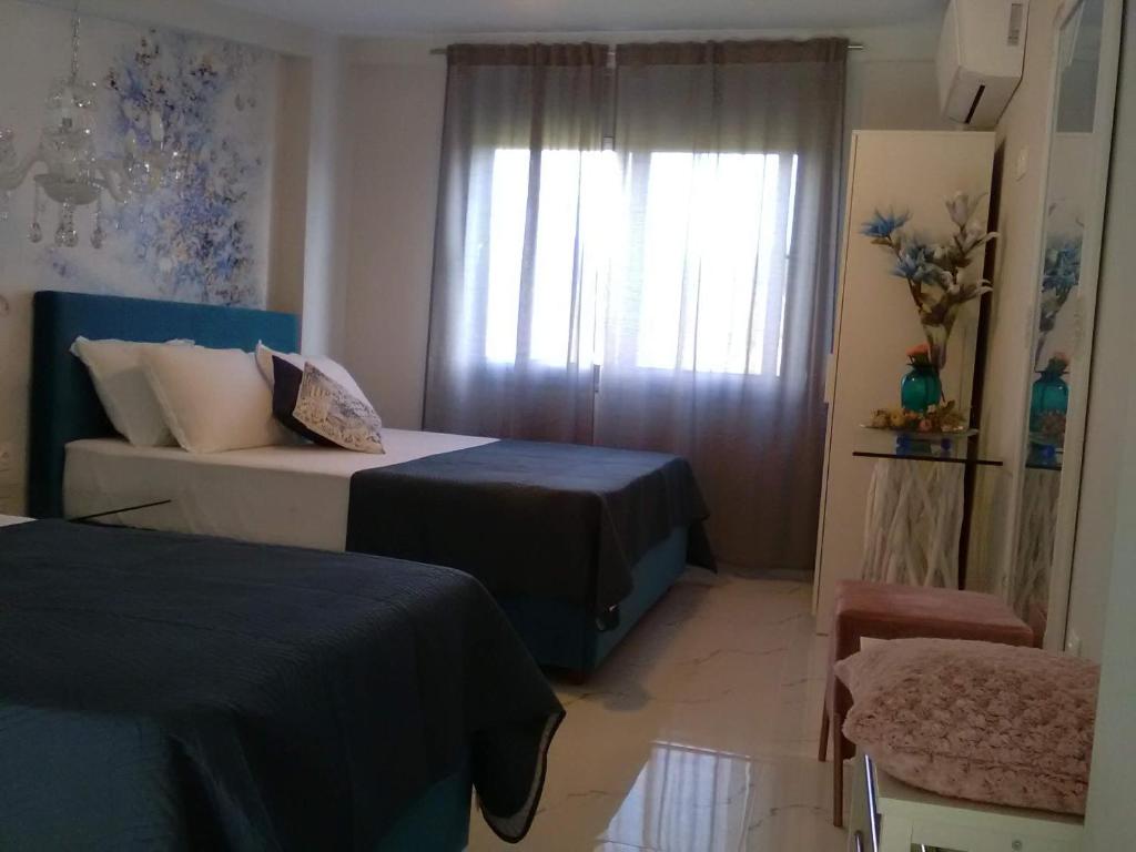 Postel nebo postele na pokoji v ubytování Divine Luxury Apartments