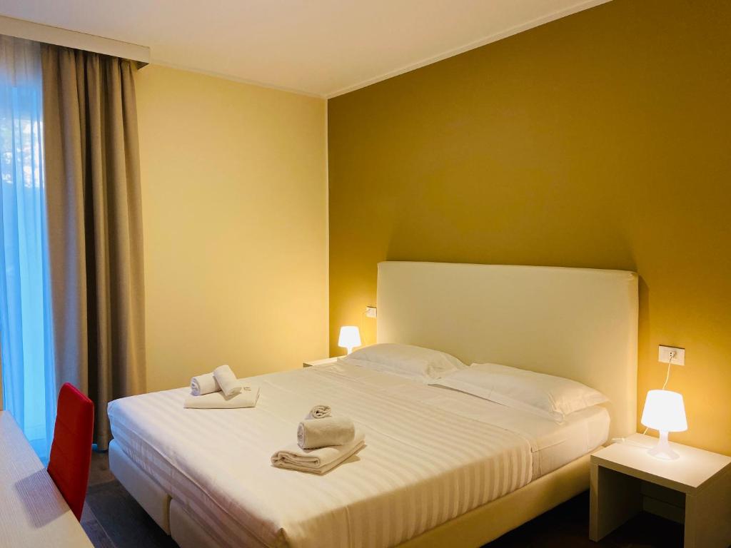 Postel nebo postele na pokoji v ubytování Verona Enjoy