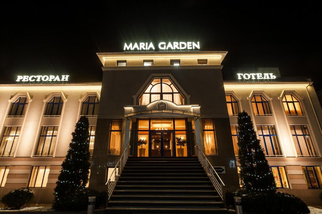 a building with a staircase leading to the front door at Maria Garden hotel & restaurant in Ivano-Frankivsk