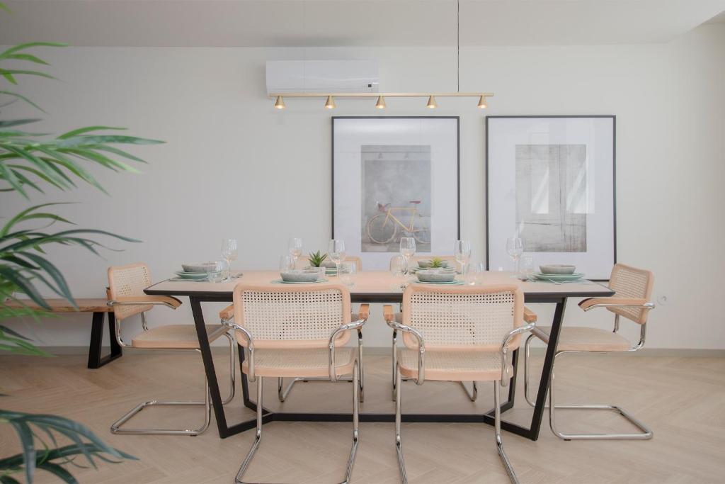 a dining room with a table and chairs at Liiiving in Porto - Luxury Beachfront Apartments in Porto