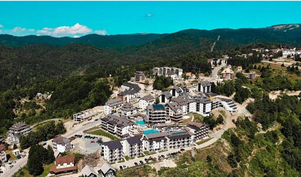 an aerial view of a resort in the mountains at -- Milmari President apartments -- in Kopaonik