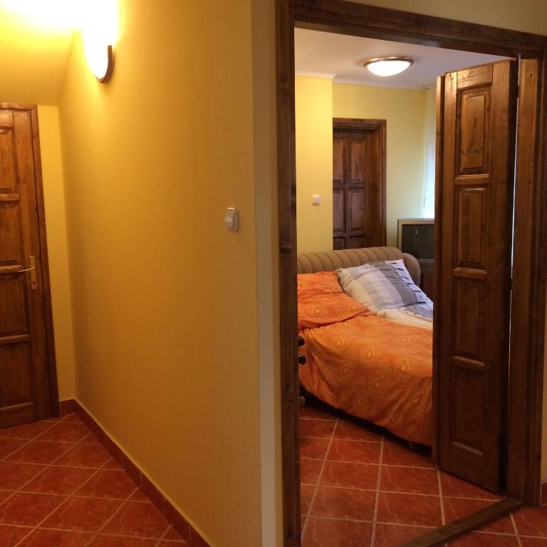 Posteľ alebo postele v izbe v ubytovaní Dávid Apartman