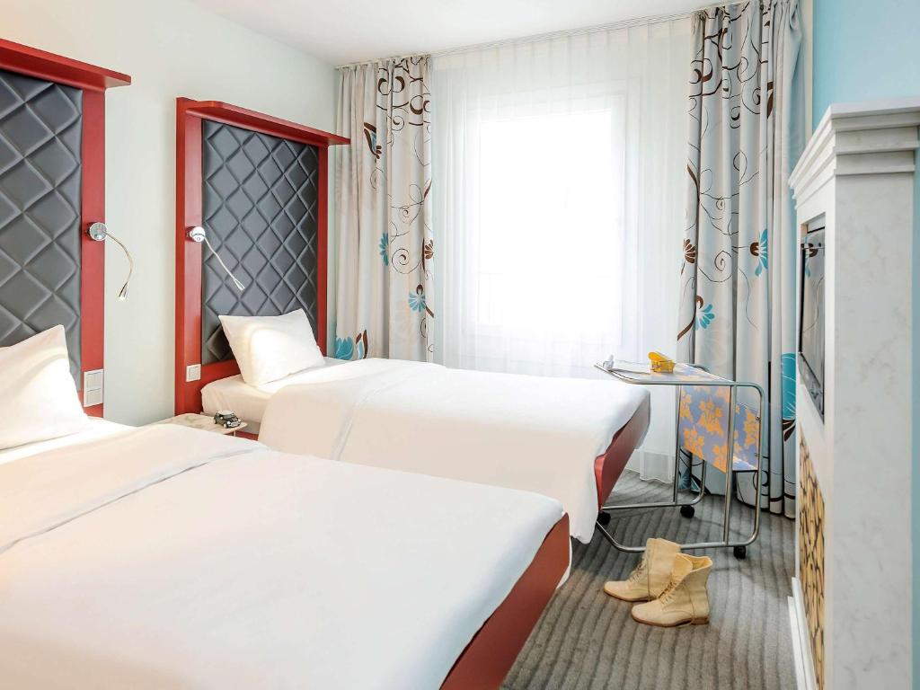 Postel nebo postele na pokoji v ubytování ibis Styles Hotel Berlin Mitte