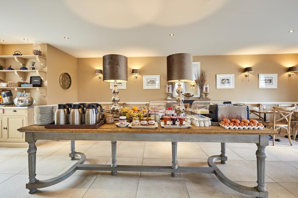 a table with food on it in a kitchen at Les Villas d'Arromanches, Teritoria in Arromanches-les-Bains