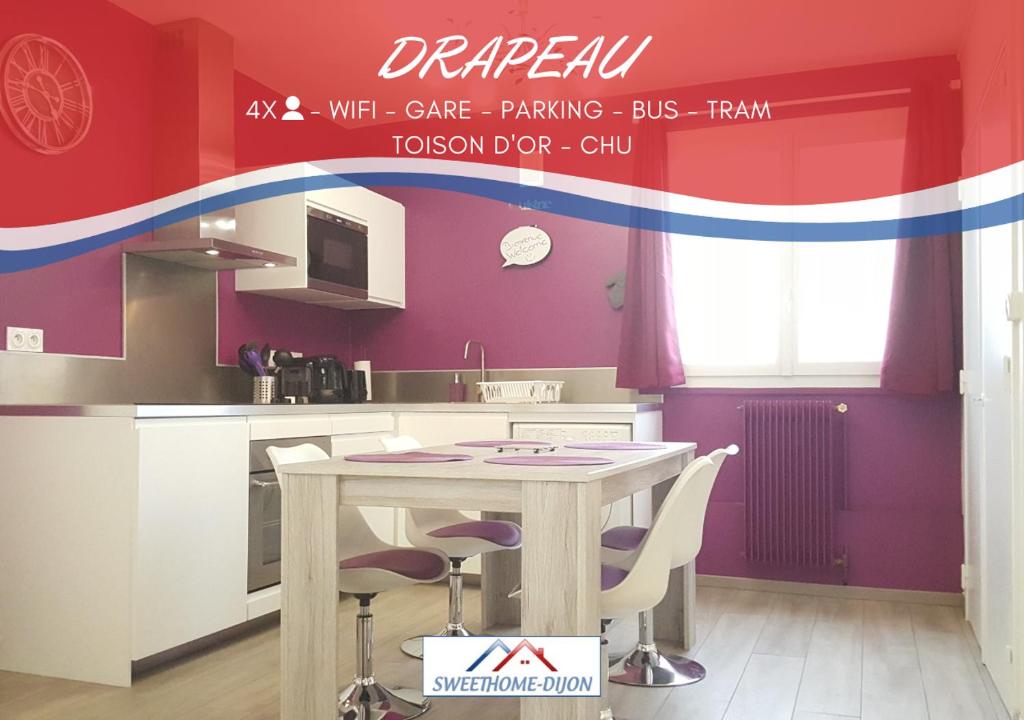 a kitchen with a table and chairs in a room at SWEETHOME DIJON - Drapeau in Dijon