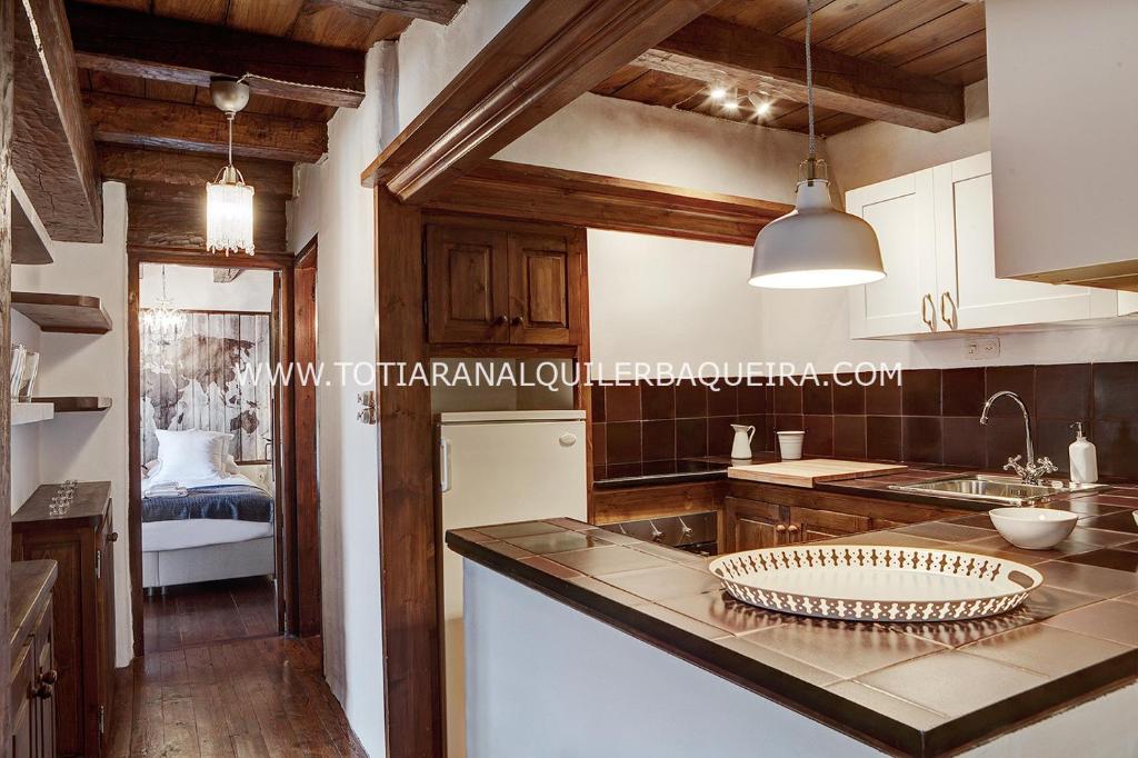 A kitchen or kitchenette at Apartamento Era Cascada By Totiaran