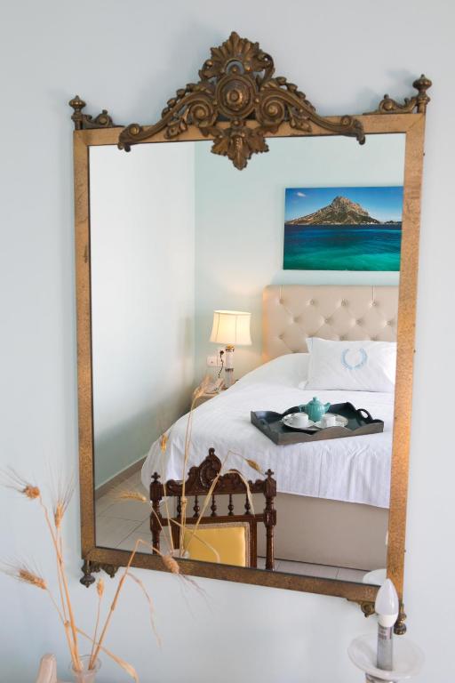 Postel nebo postele na pokoji v ubytování MasouriBlu Boutique Hotel