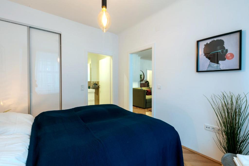 Postel nebo postele na pokoji v ubytování Vienna Elegance Apartment
