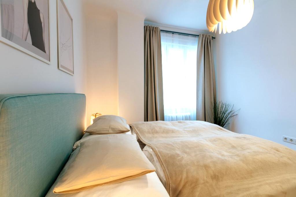 Postel nebo postele na pokoji v ubytování Vienna Elegance Apartment