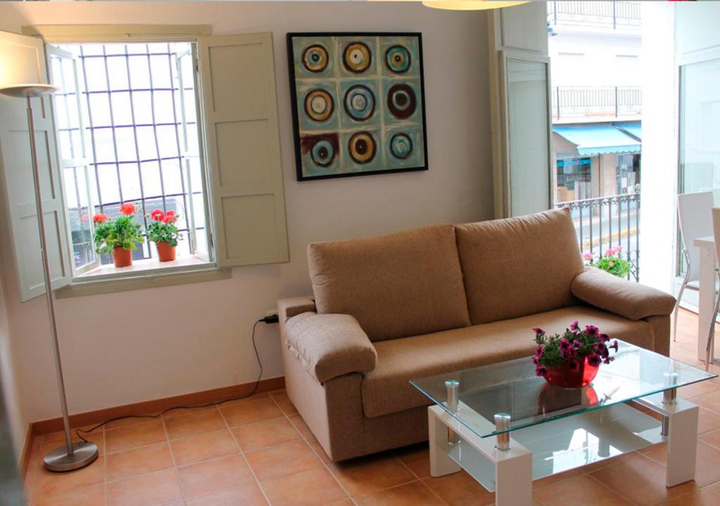 A seating area at Apartamentos Villaaltea - Bella