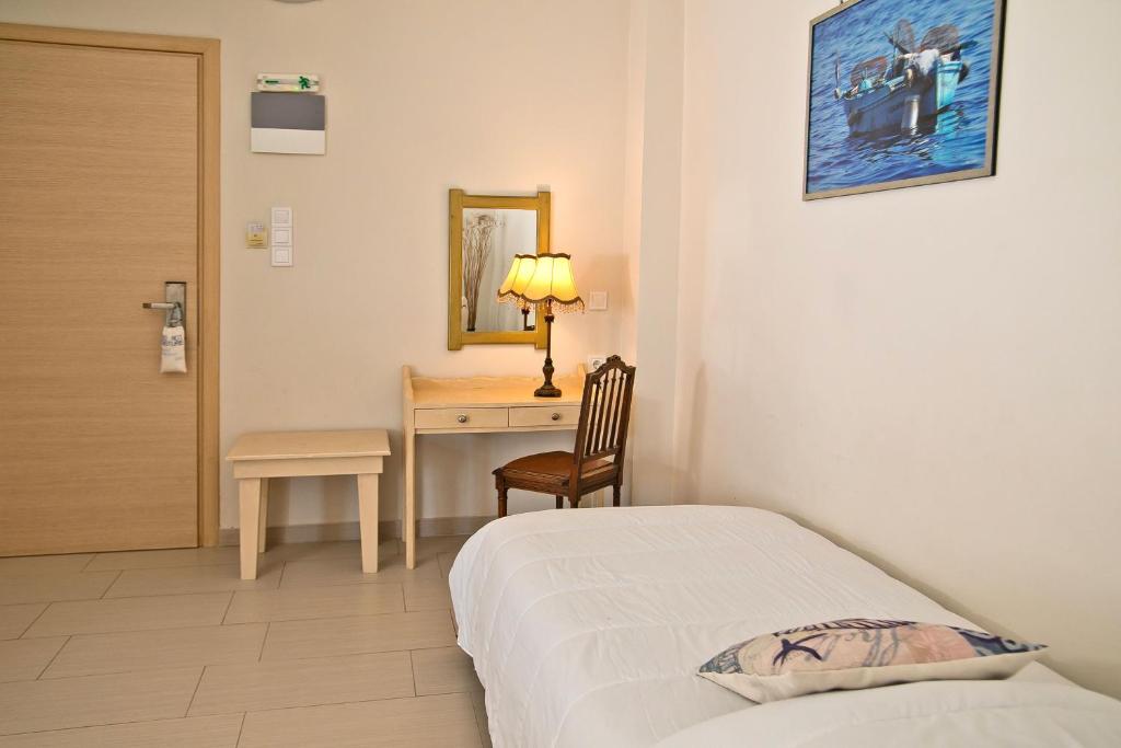 Postel nebo postele na pokoji v ubytování MasouriBlu Boutique Hotel