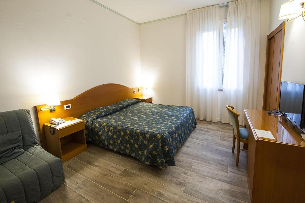 Posteľ alebo postele v izbe v ubytovaní Hotel Italia