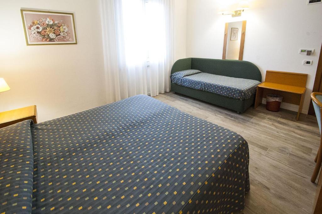 Posteľ alebo postele v izbe v ubytovaní Hotel Italia