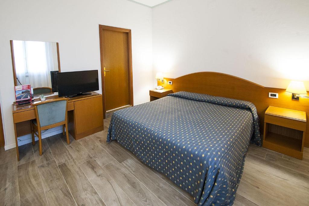 Posteľ alebo postele v izbe v ubytovaní Hotel Italia