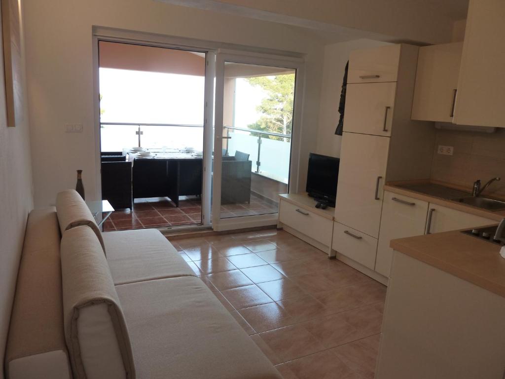 Kuchyň nebo kuchyňský kout v ubytování Apartments Ori