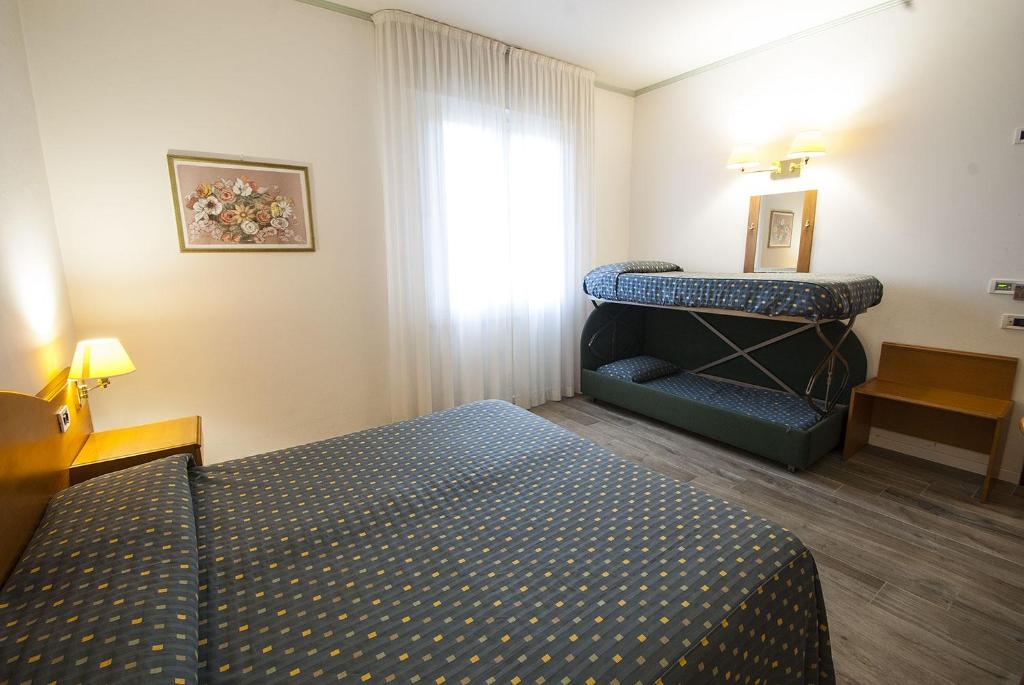 Posteľ alebo postele v izbe v ubytovaní Hotel Italia