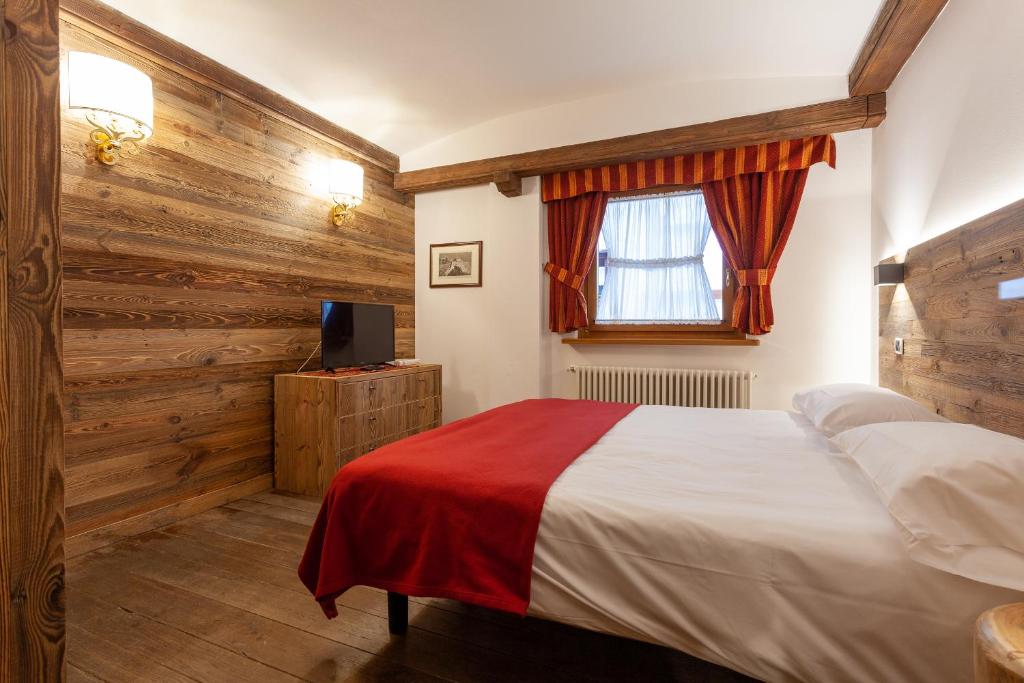 Postel nebo postele na pokoji v ubytování Residence Le Grand Chalet