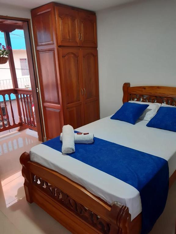 Postel nebo postele na pokoji v ubytování Hotel Jardín de Rosas
