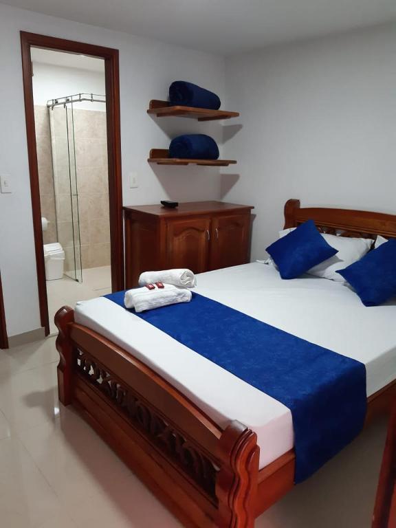 Postel nebo postele na pokoji v ubytování Hotel Jardín de Rosas