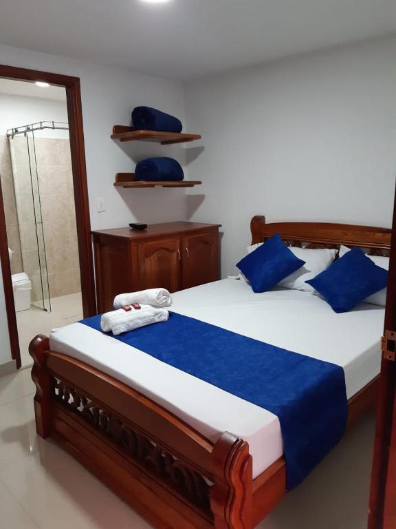 Postel nebo postele na pokoji v ubytování Hotel Jardín de Rosas