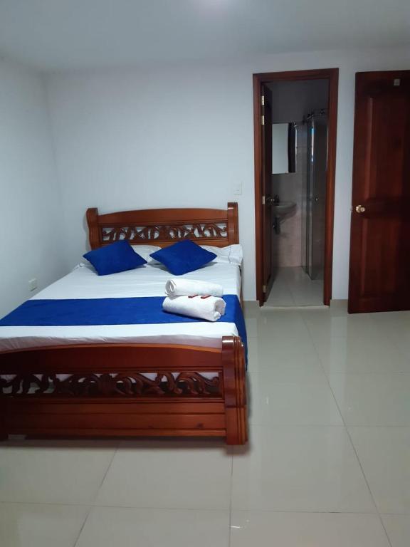 Postel nebo postele na pokoji v ubytování Hotel Jardín de Rosas