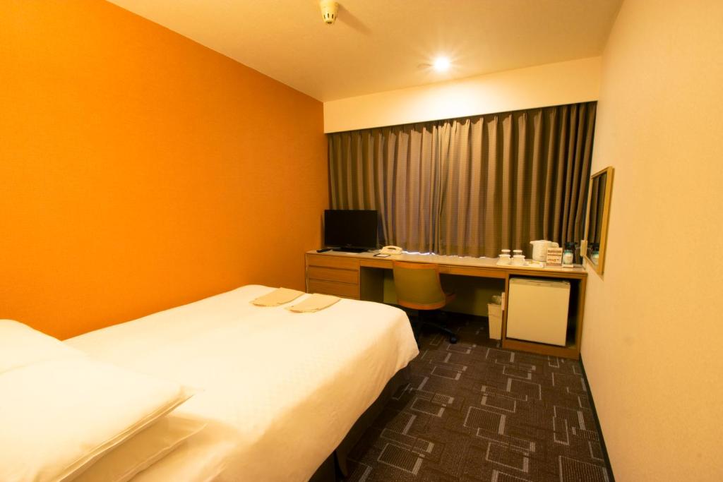 Postel nebo postele na pokoji v ubytování IP City Hotel Osaka - Imperial Palace Group