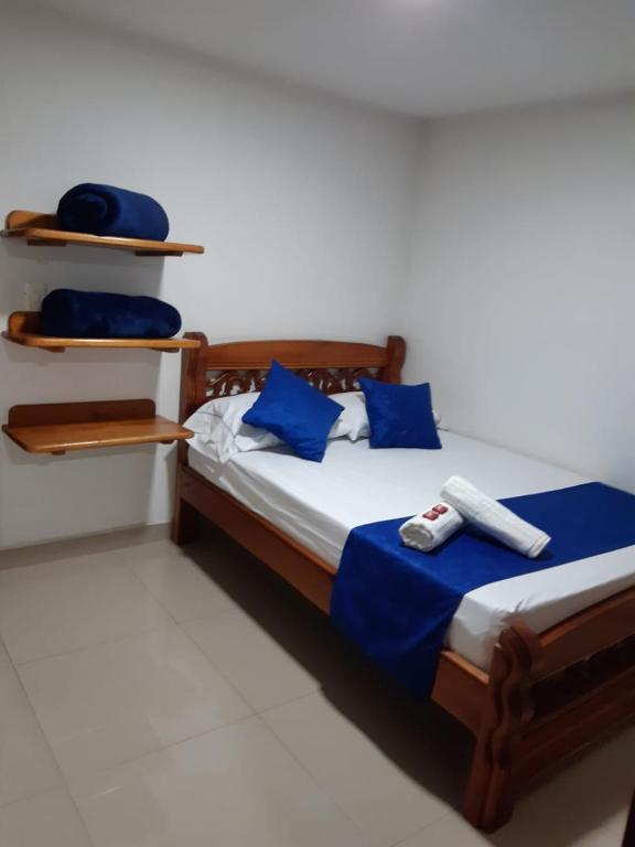 Postel nebo postele na pokoji v ubytování Hotel Jardín de Rosas