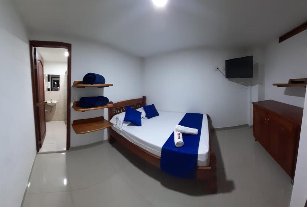 Postel nebo postele na pokoji v ubytování Hotel Jardín de Rosas