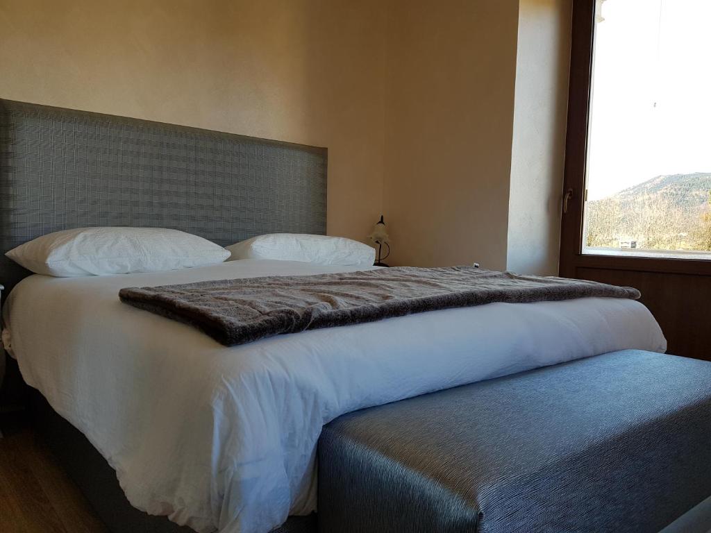 Łóżko lub łóżka w pokoju w obiekcie Villa Ciardi Wellness Hotel & Ristorante