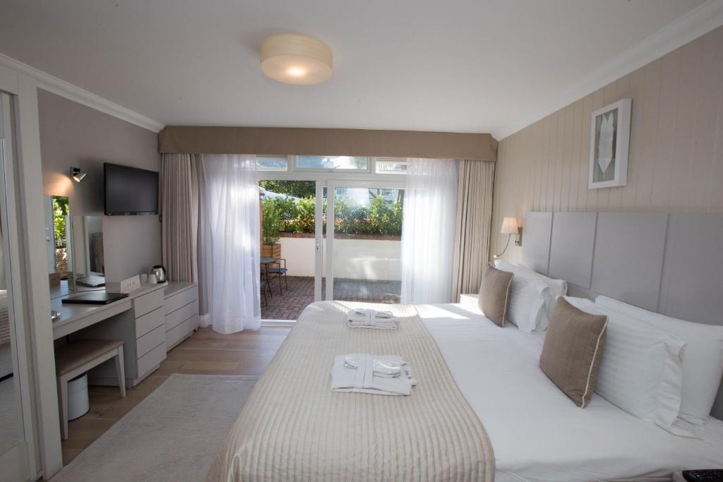 Postel nebo postele na pokoji v ubytování Hotel La Place