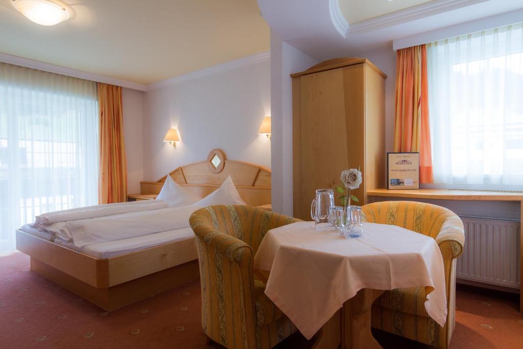 Posteľ alebo postele v izbe v ubytovaní Hotel Garni Martina