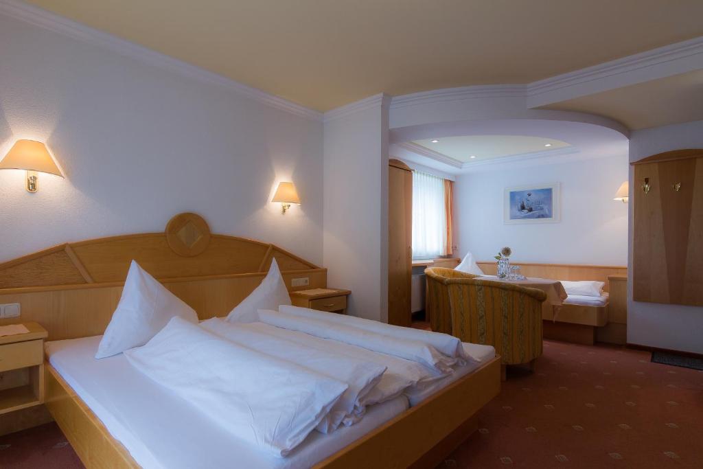 Posteľ alebo postele v izbe v ubytovaní Hotel Garni Martina
