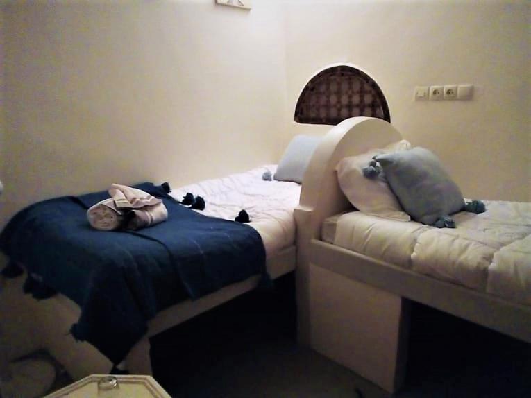 Postel nebo postele na pokoji v ubytování Riad Alqimam