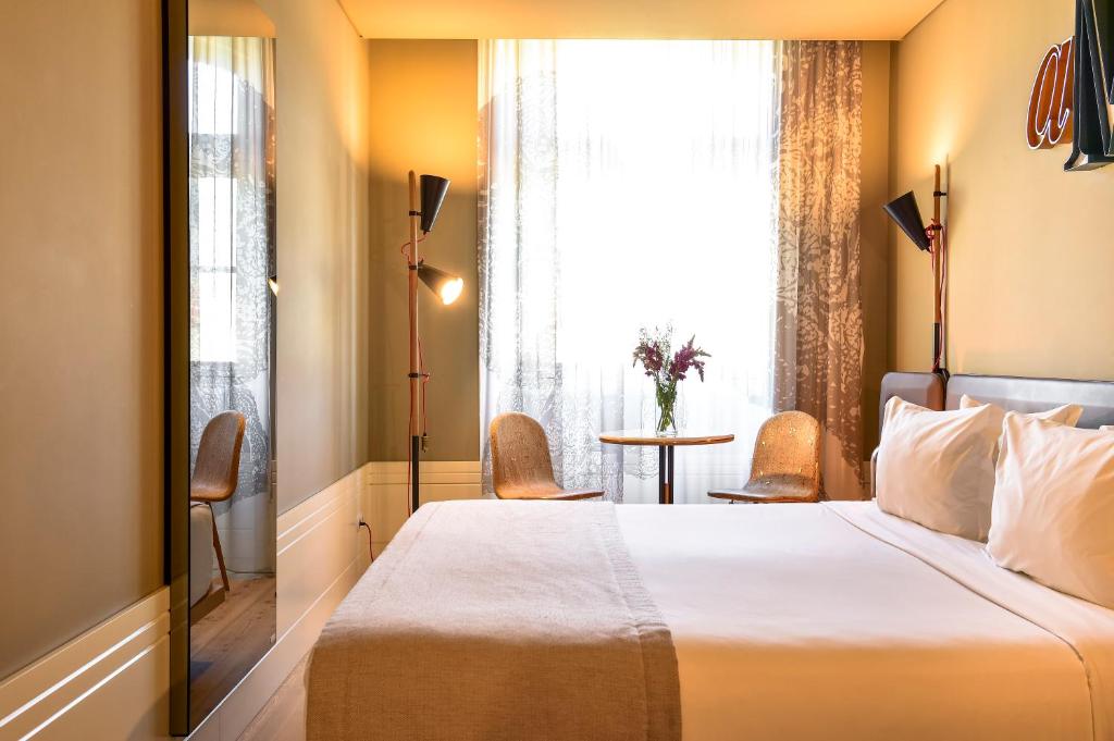 Postel nebo postele na pokoji v ubytování My Story Hotel Rossio