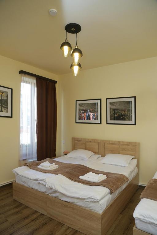Postel nebo postele na pokoji v ubytování Guest House MARGARYAN