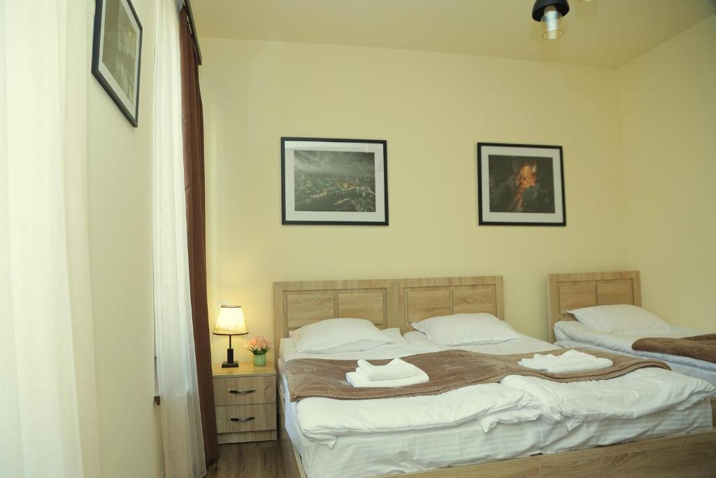 Postel nebo postele na pokoji v ubytování Guest House MARGARYAN