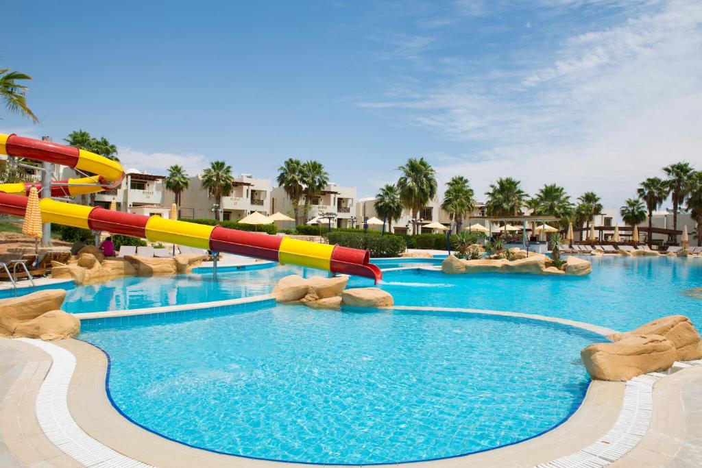 a water slide in a pool at a resort at Amphoras Aqua in Sharm El Sheikh