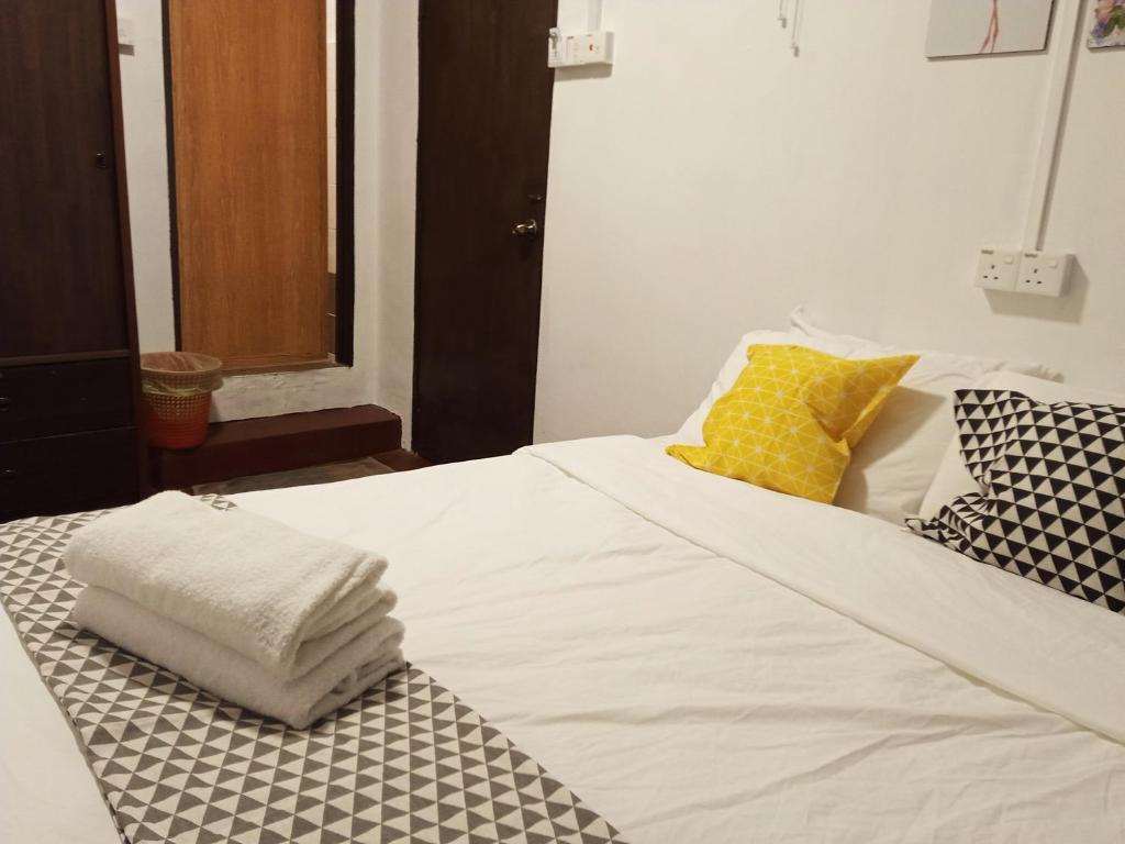 Postel nebo postele na pokoji v ubytování Pengkalan Dua