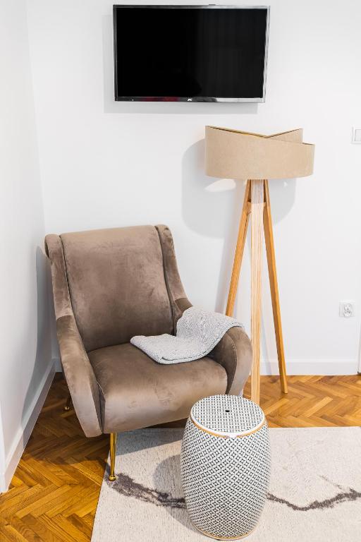 Televízia a/alebo spoločenská miestnosť v ubytovaní Main Square Apartments - LoftAffair