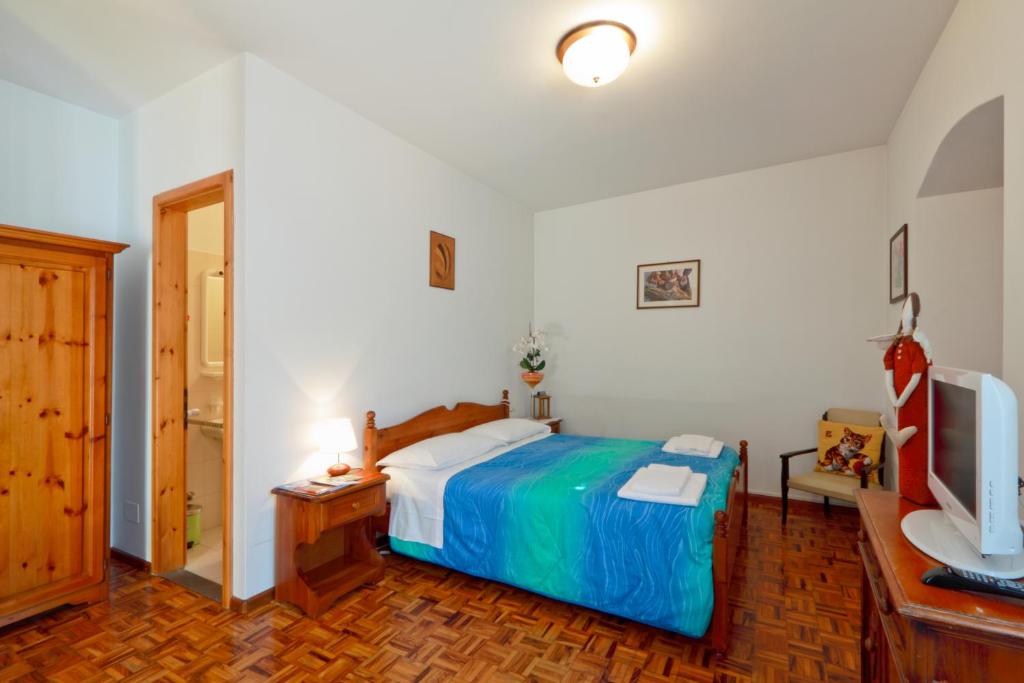 Postel nebo postele na pokoji v ubytování Albergo Alle Alpi