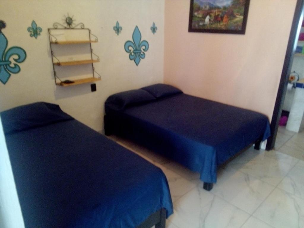 Postel nebo postele na pokoji v ubytování Casa Santuario Hotel Boutique