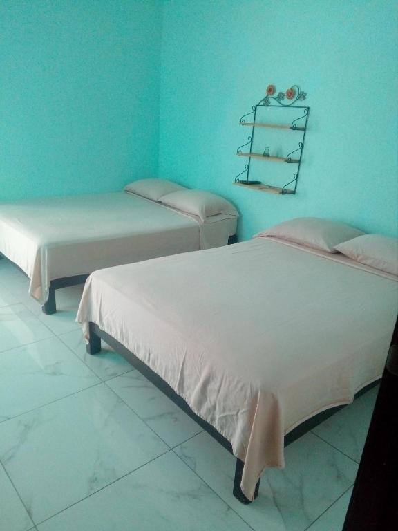 Postel nebo postele na pokoji v ubytování Casa Santuario Hotel Boutique
