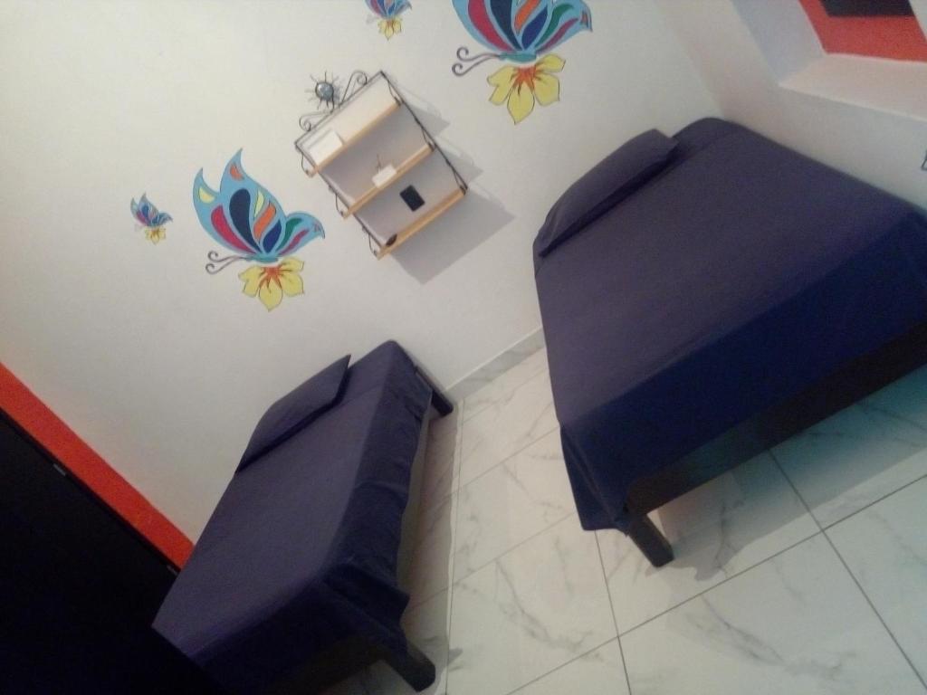 Postel nebo postele na pokoji v ubytování Casa Santuario Hotel Boutique