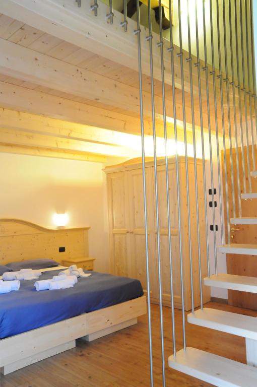 Albergo alla Postaにあるベッド