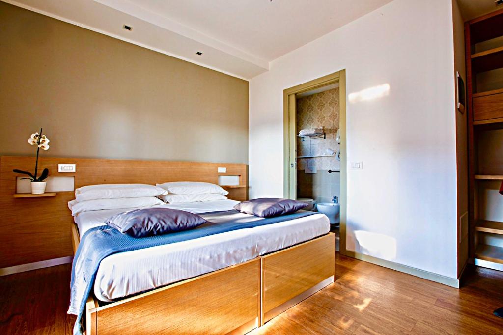 Postel nebo postele na pokoji v ubytování Hotel Liane Riccione